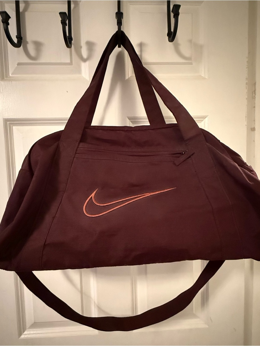 Nike Burgundy Duffel Bag with Orange Swoosh